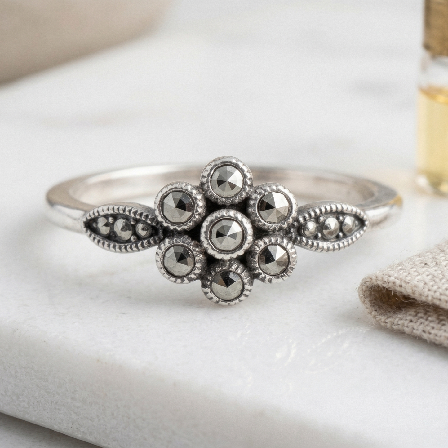 STAINLESS STEEL ANTIQUE 7 ROUND CRYSTAL FLOWER RING