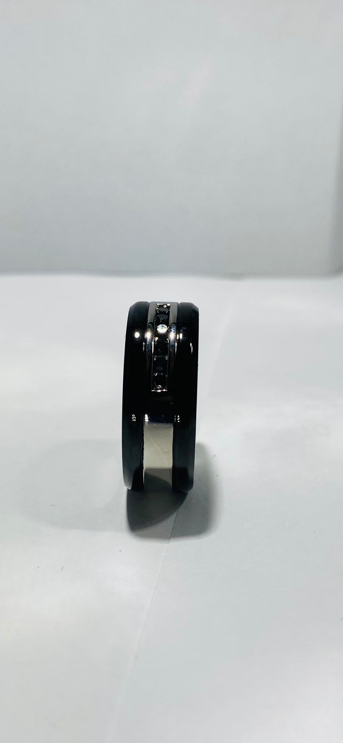 Madison Collections BLACK STAINLESS STEEL RING WITH SILVER AND 6 BLACK CRYSTAL STONE 10"